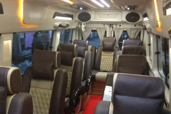 11+1 seater deluxe 1x1 maharaja tempo traveller hire