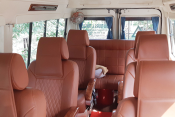 6 seater deluxe 1x1 tempo traveller with sofa seating